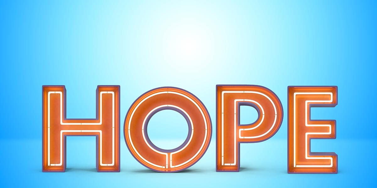 Large neon sign that says HOPE